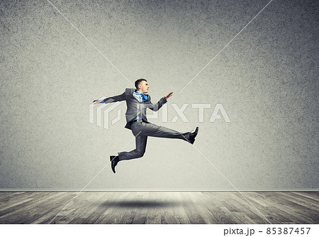 Businessman jumping high Businessman jumping high 85387457