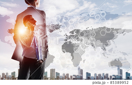 Concept of business success and control with confident boss against cityscape background 85389952