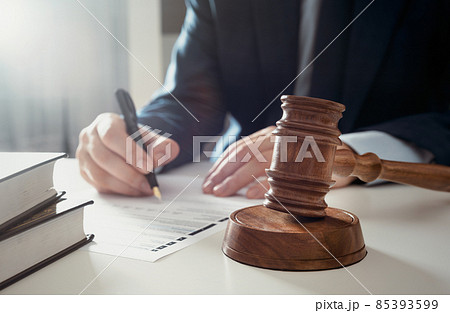 Lawyer working in the office. Singing agreement 85393599