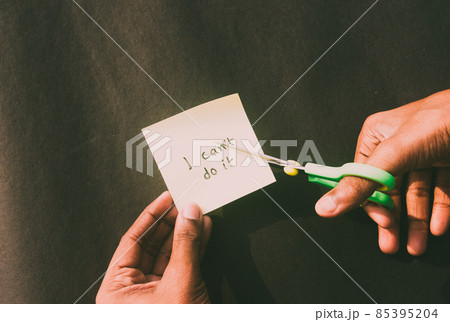Hands cutting letter T with scissors with written text i cant do it. Business concept for determination Success Challenge self believe Motivation and aspirations to achieve results Aim goal. Hands cutting letter T with scissors with written text i cant do it. Business concept for determination Success Challenge self believe Motivation and aspirations to achieve results Aim goal. 85395204