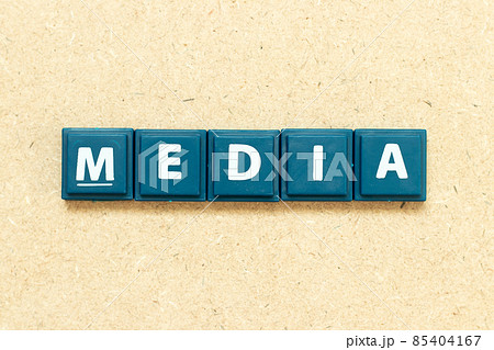 Tile alphabet letter in word media on wood background Tile alphabet letter in word media on wood background 85404167