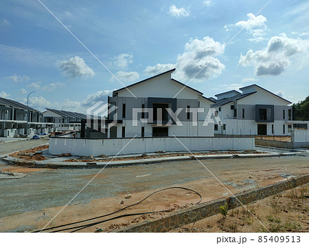 PENANG, MALAYSIA -JULY 26, 2021: Selected focused on new double story terrace house under construction in Malaysia. Designed by an architect with a modern and contemporary style. 85409513