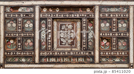 Wooden seamless floral pattern ornaments on old wooden chair Wooden seamless floral pattern ornaments on old wooden chair 85411020