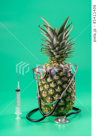 Interpretation of pineapple fruit in a human image with glasses and the concept of bio medicine new technologies. Interpretation of pineapple fruit in a human image with glasses and the concept of bio medicine new technologies. 85411406