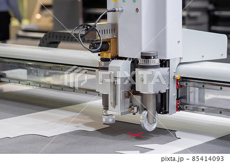 Digital flatbed cutter, plotter cutting white cardboard sheet at exhibition Digital flatbed cutter, plotter cutting white cardboard sheet at exhibition 85414093