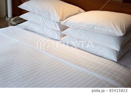 Bed with pillows in bedroom hotel 85415822