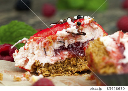 fresh cake with red raspberry jam 85428630