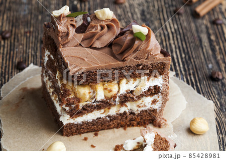 delicious cake with chocolate cream flavor with nuts 85428981