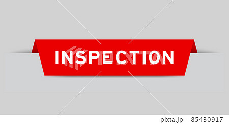 Red color inserted label with word inspection on gray background 85430917