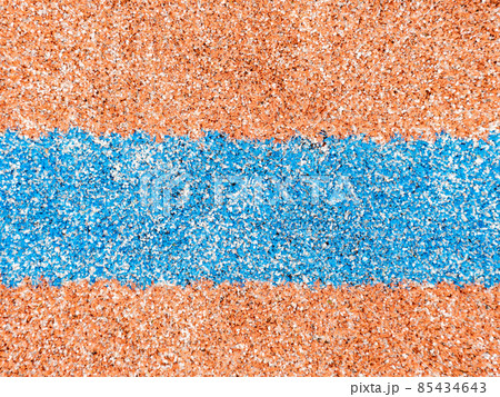 Red artifical carpet with blue border line. The outdoor ball game playfield. 85434643