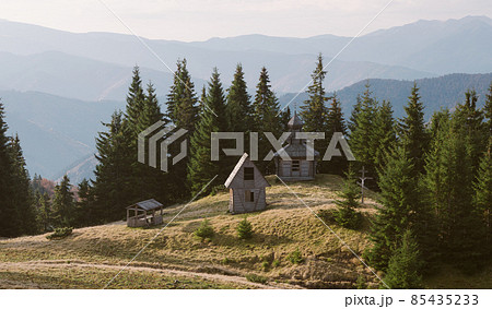 Old wooden church in a forest Old wooden church in a forest 85435233