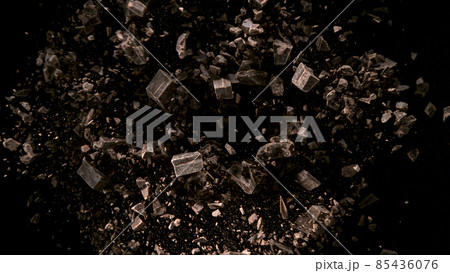 Rotating Chocolate Chunks on Black Background. 85436076