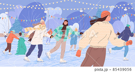 People skate on the ice rink in the winter evening People skate on the ice rink in the winter evening 85439056