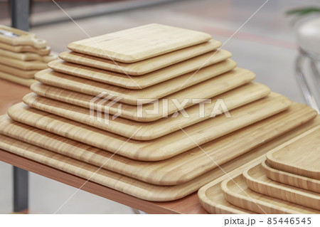 Many different beech and bamboo wooden chopping boards. Eco-friendly household goods and kitchen utensils 85446545