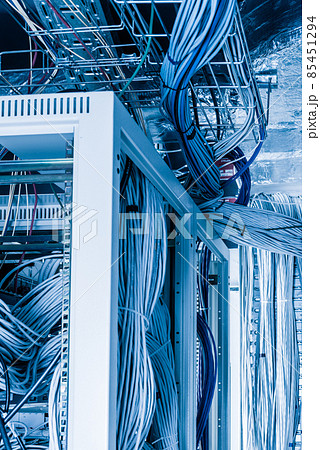 bunch of network cables in wave pattern leading across server ro bunch of network cables in wave pattern leading across server ro 85451294