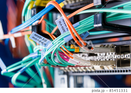 detail of server rack with fiber optic cables attached to front 85451331