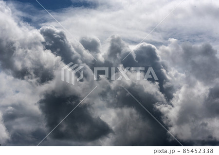 Dramatic dark storm rain clouds black sky background. Dark thunderstorm clouds rainny atmosphere. Meteorology danger windstorm disasters climate. Dark cloudscape storm disaster gloomy gray cloud sky 85452338