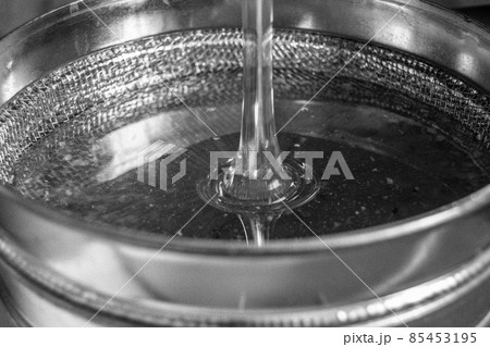 Drop of bee honey drip from hexagonal honeycombs Drop of bee honey drip from hexagonal honeycombs 85453195