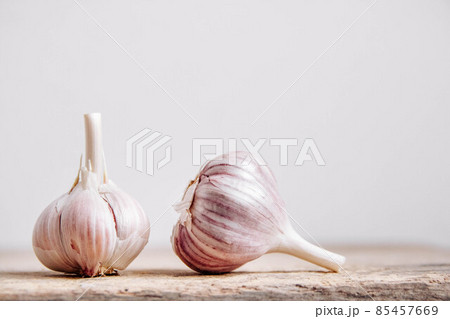 Garlic bulb on a rustic wooden background. Copy, empty space for text 85457669