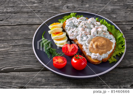 danish smorrebrod with shrimps, mayo, roe, and egg 85460666