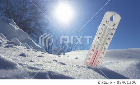 The thermometer in winter lies on the snow and shows low negative air temperature. Meteorological conditions in the harsh climate in the northern regions and the environment.Climate change on Earth The thermometer in winter lies on the snow and shows low negative air temperature. Meteorological conditions in the harsh climate in the northern regions and the environment.Climate change on Earth 85461306