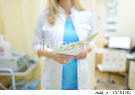 The surgeon doctor is examining a results of check up of patient and appoint plan of treatment. Practitioner at work place in medical office at the clinic. The surgeon doctor is examining a results of check up of patient and appoint plan of treatment. Practitioner at work place in medical office at the clinic. 85461606
