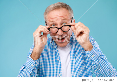 Surprised mature man in glasses staring at camera Surprised mature man in glasses staring at camera 85462307