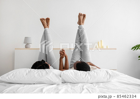 Glad happy young african american husband and...の写真素材 [85462334] - PIXTA