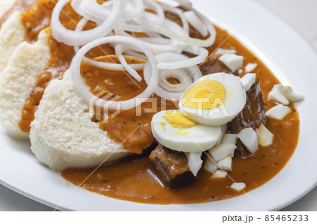 beef goulash with onion rings, boiled egg and dumplings beef goulash with onion rings, boiled egg and dumplings 85465233