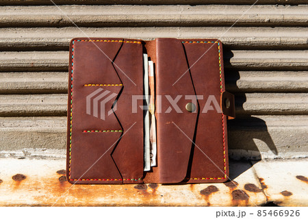 hand made leather wallet . Leather craft. Selective focus 85466926