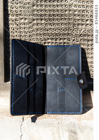 hand made leather wallet . Leather craft. Selective focus hand made leather wallet . Leather craft. Selective focus 85466933