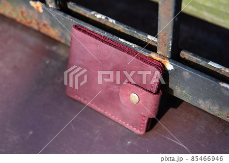 hand made leather wallet . Leather craft. Selective focus hand made leather wallet . Leather craft. Selective focus 85466946