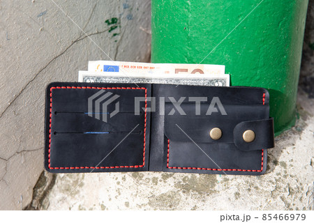 hand made leather wallet . Leather craft. Selective focus 85466979