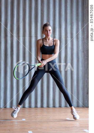 Woman tennis player working out in the gym 85467086