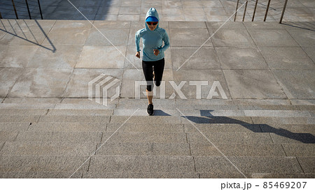 Fitness sports woman running up stairs in city 85469207