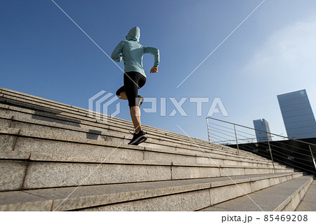 Fitness sports woman running up stairs in city 85469208