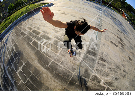 Skateboarder skateboarding outdoors in city 85469683