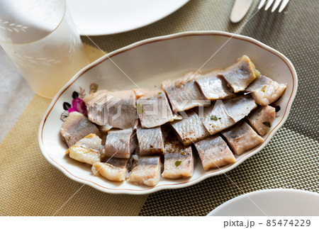 Pieces of herring served on plate Pieces of herring served on plate 85474229