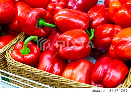 Closeup of ripe red bell peppers Closeup of ripe red bell peppers 85474261