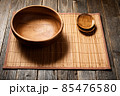 Empty wooden bowl on natural background. 85476580
