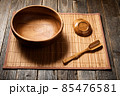 Empty wooden bowl on natural background. 85476581