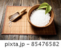 Wooden bowl with salt on natural background. 85476582