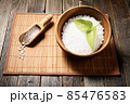 Wooden bowl with salt on natural background. 85476583
