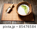 Wooden bowl with salt on natural background. 85476584