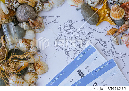World map, seashells and pebbles boarding pass. Travel vacation concept. Summer sea holidays. Tourism and resorts. World map, seashells and pebbles boarding pass. Travel vacation concept. Summer sea holidays. Tourism and resorts. 85478236
