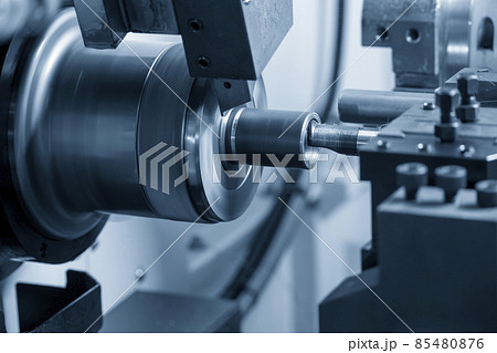 The  CNC lathe machine boring cutting the metal pipe  parts. 85480876