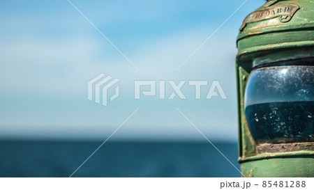 Aged green lantern on cruising yacht 85481288