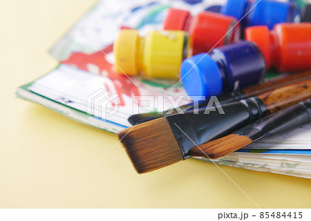 art brush and colors on a paper with copy space , 85484415