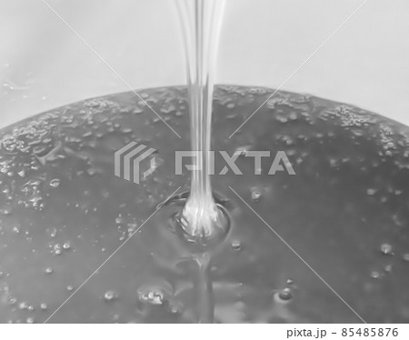Drop of bee honey drip from hexagonal honeycombs Drop of bee honey drip from hexagonal honeycombs 85485876