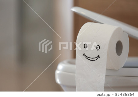Modern toilet bowl with paper in bathroom, closeup. Space for text 85486864